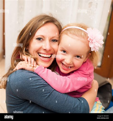 Mother Daughter Playing With In Living Room Stock Footage